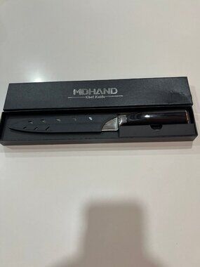 MDHAND Chef Knife is a versatile kitchen tool featuring a distinctively shaped